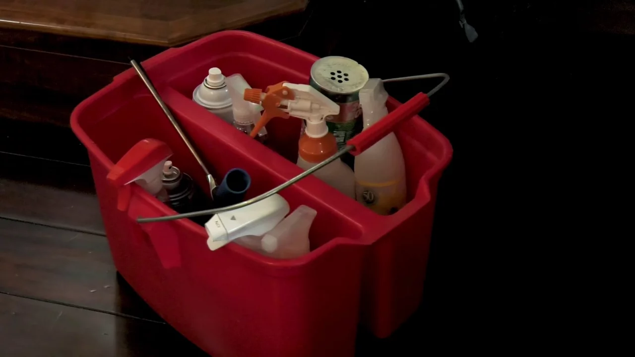 home cleaning supplies in red bucket for maid service business
