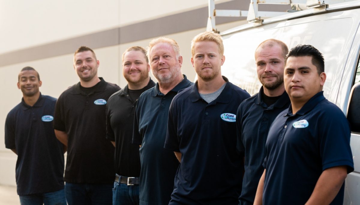Group of Pros standing together in front of a truck