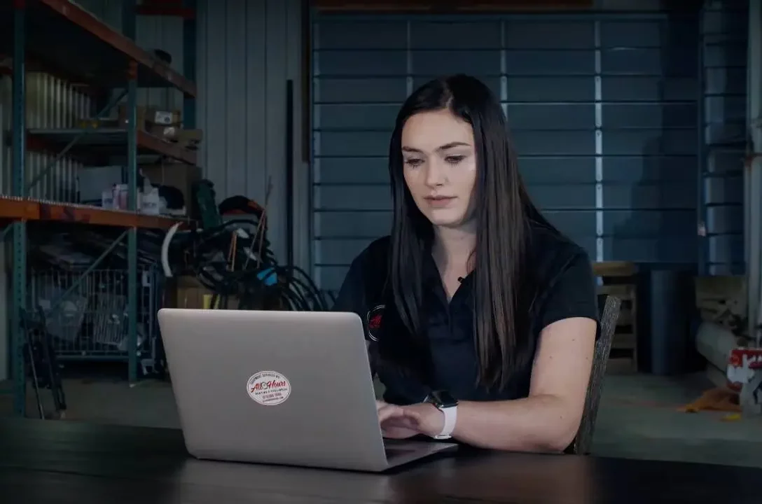 Woman pro using laptop at warehouse