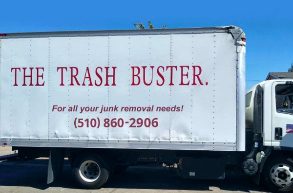 The trash buster junk removal company truck