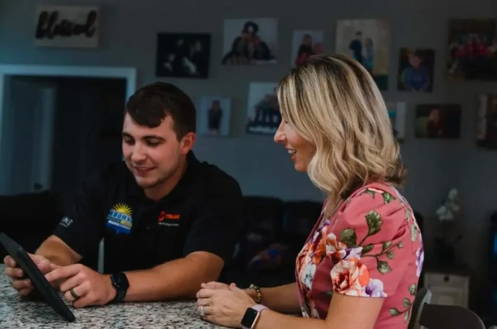 - Housecall Pro Pro with satisfied female customer with blonde hair