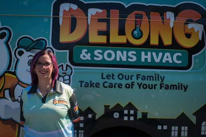 Amber Delong in front of Delong work van
