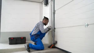 Pro doing installation and repair on garage door