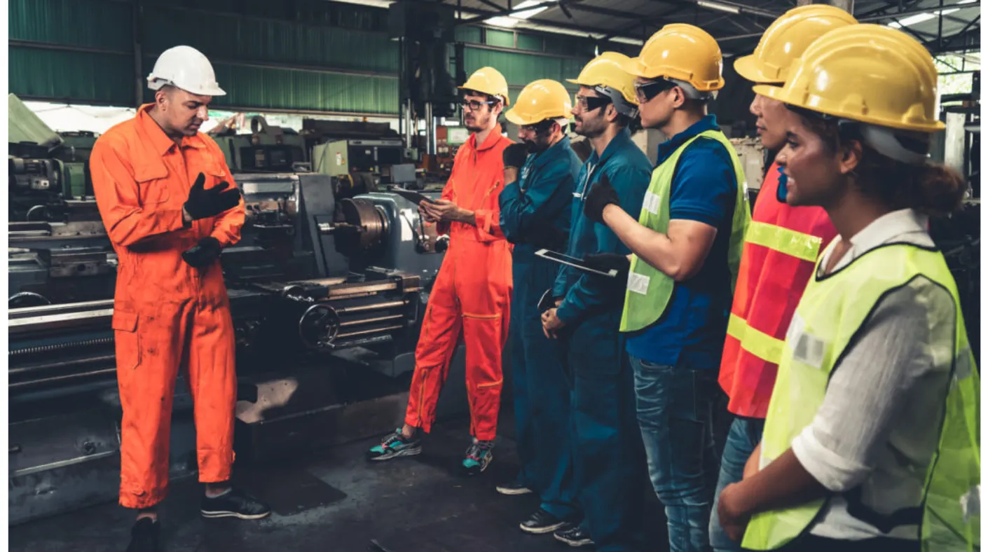 Senior Field Service Technician guiding his subordinates about efficiency