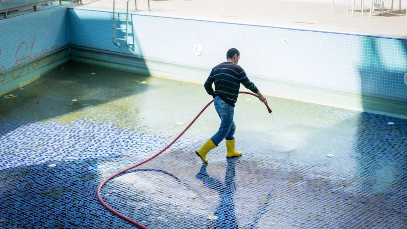 pro cleaning a pool