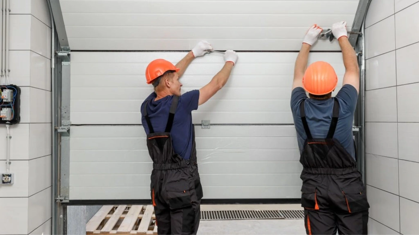 pros working as automatic garage door opener repair service technicians
