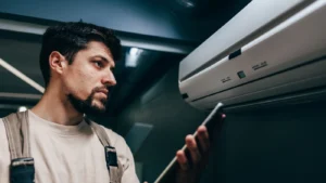 technician reading to check the air conditioner