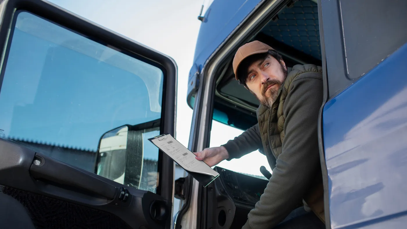 Businessman looking out of his pickup truck