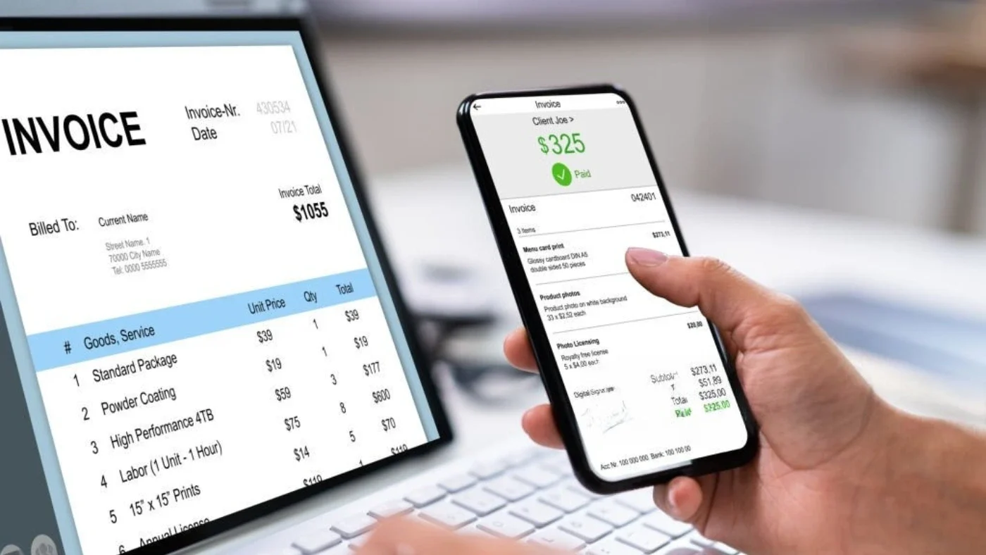man is looking at an invoice and paying it using his phone