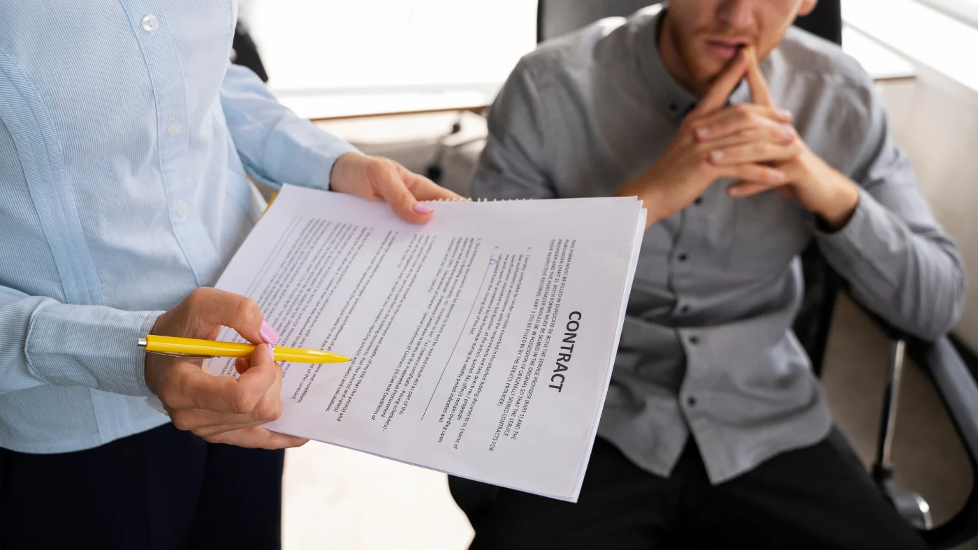 pro writing and discussing an electrical contract business plan