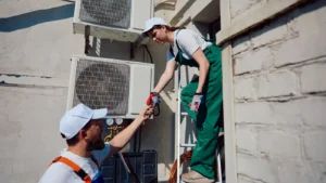 hvac technicians helping each other