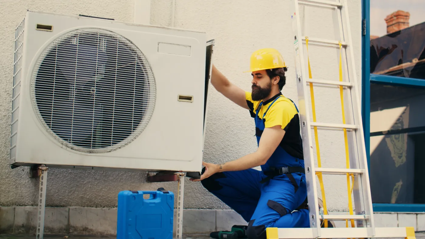 Pro working on an air conditioner
